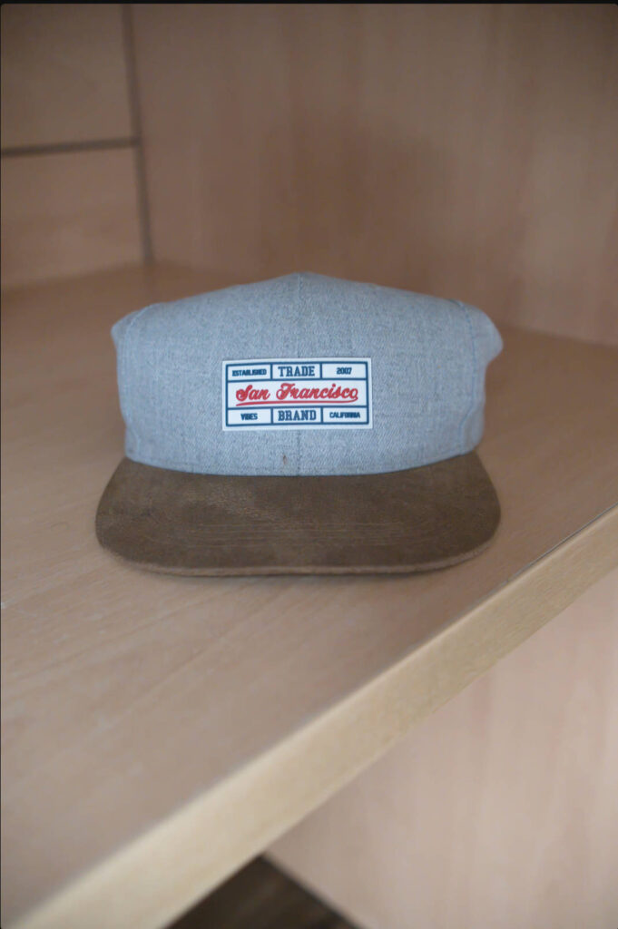 Close-up photo of the baseball cap on a wooden shelf after Luminar Neo's Noiseless AI has been applied, showing reduced image noise