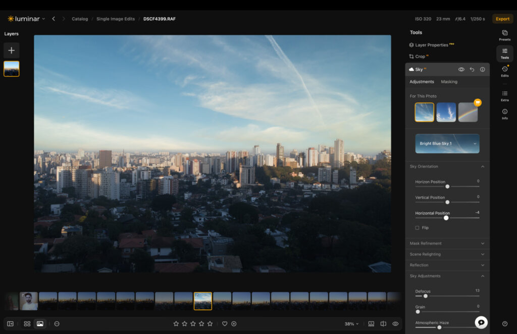 Luminar Neo sky replacement panel with Bright Blue Sky option applied to a cityscape photo, showing sky suggestion thumbnails and adjustment sliders