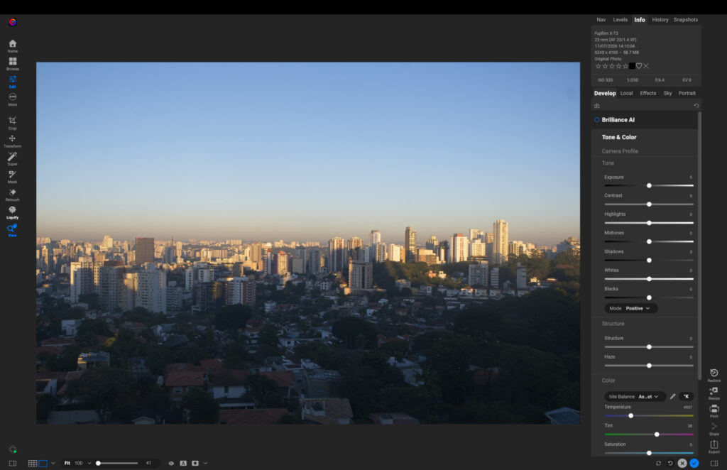 ON1 Photo RAW editing interface showing the original cityscape RAW file with a hazy sky before sky replacement, and the Tone & Color adjustment panel