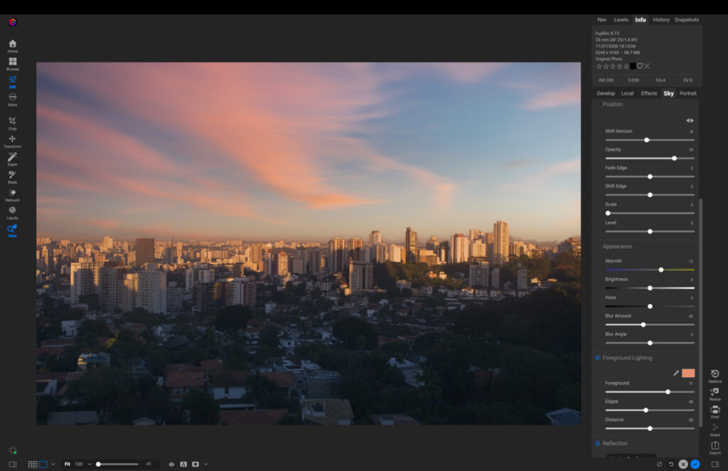 ON1 Photo RAW cityscape photo after sky replacement with a pink and orange sunset sky applied, with the Sky adjustment panel open